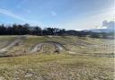 Picture shows sheep grazing on the motocross track at the farm near Humbie. Image: East Lothian Council planning portal