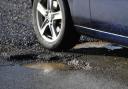Residents are being urged to report potholes to the council