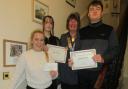 Dunbar Rotary club president Elaine O'Brien congratulates Caitlin Wishart, Anthony Birrell and Rebecca Porteous