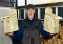 Jim Mcalpine with two of his hand made bird boxes