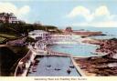A postcard from the mid-20th century depicting the swimming pool, boating pond and pavilion, Dunbar. A number of boats are in the pond. To the right is Dhu Rock. All images courtesy of East Lothian East Lothian Council Archives & Museums