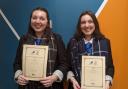 Twin sisters Kerra, left, and Dayle Stewart, pupils at Musselburgh Grammar School, with their 'Express Yourself' certificates after successfully completing a creative writing and drama course delivered by the Bridges Project in Musselburgh in