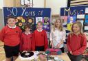 These current Law Primary School pupils explore music through the decades at Law Primary School... learning all about cassette tapes and vinyl