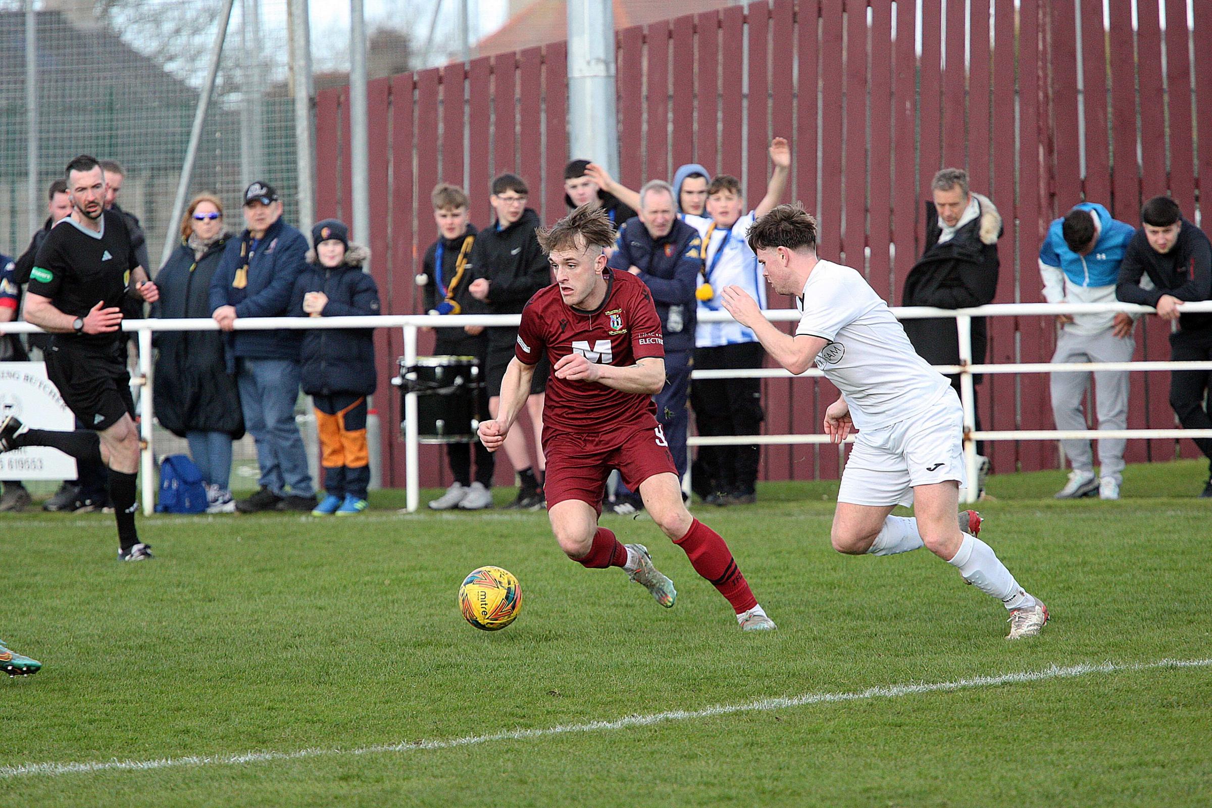 Tranent (maroon) saw their hopes of the South of Scotland Challenge Cup ended by East Kilbride
