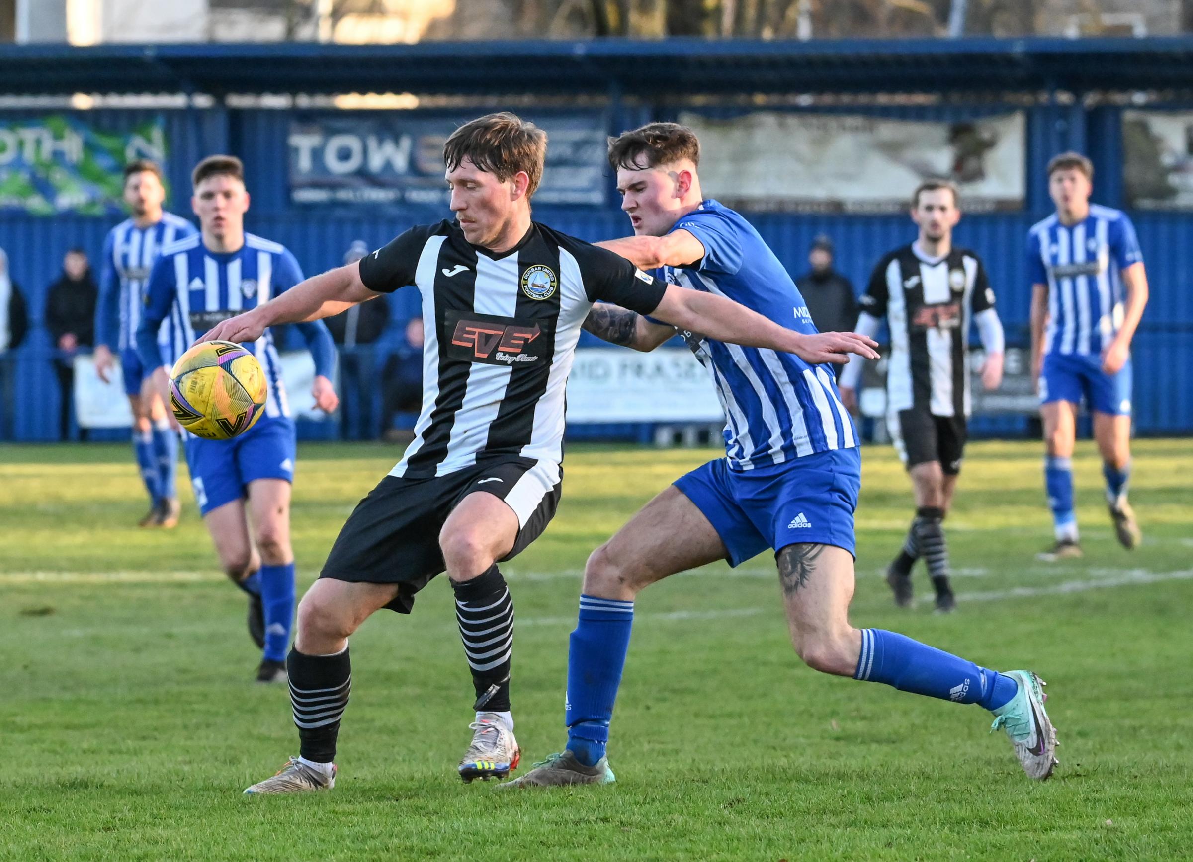 Dunbar United (black and white) edged out Penicuik Athletic and now sit fourth in the Premier Division table. Image: Alan Wilson.