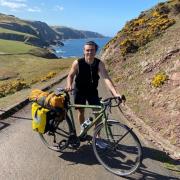 Lachlan Irvine-Hand is cycling the North Coast 500 to help raise money to two internships he is embarking on over the next year
