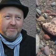 Tim Porteus (left) and the heart-shaped stone Finn found on the beach