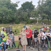 Wilma Gare, a member of FOOP, cut the ribbon at the grand opening of the Ormiston Pump Track on Sunday
