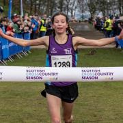 Cerys Wright crosses the finish line in Callendar Park to be crowned a national champion. Image: Bobby Gavin (thatonemoment.co.uk)