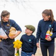 The Calder family children Maisie, Louisa and Charlie, have been getting preparations underway for the farm's Spring Market. Image: Phil Wilkinson Photography