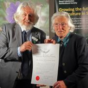David Knott, honorary president of the Royal Caledonian Horticultural Society, hands over the award to Beryl MacNaughton