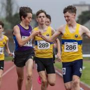 Howie Allison (purple) crosses the line to qualify from the under-15 1,500m heats. Image: Bobby Gavin