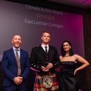 East Lothian Cottages was awarded the Climate Action Award, sponsored by Times Scotland. Pictured left to right is: Jeremy Lazell, editor of Times Alba with Andrew Watson, owner of East Lothian Cottages and presenter Zara Janjua. Image: Connor Mollison