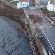 Work is ongoing to repair Dunbar's Lamer Street after it was damaged following stormy weather. Image: Callum Duguid
