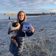 Lia Louise McBride with her Ragdoll cat Coco on the beach at Musselburgh which was the inspiration for her new children's book series