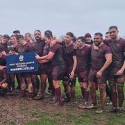 Preston Lodge RFC received the National League Division Three trophy after defeating Dumfries Saints in horrible conditions