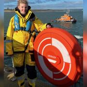 Phoebe Douglas, Scotland's first female full-time RNLI mechanic, pictured at Torness Power Station, where the all-weather lifeboat (ALB) is moored. Image: Dunbar RNLI/Alistair Punton