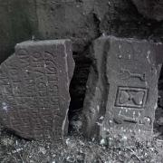 The broken gravestone at St Andrew's Kirk Ports