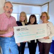 From left, Karl Cleghorn, convenor and a trustee at the Hollies Community Hub, receives a cheque for £1,000 from Carol Edmond, organiser of the Musselburgh Over 50's Club, and Irene Ferrie and Jeanette Ret, also from the club