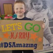 Swimmer Harry McWhinnie is raising funds for the Dwarf Sports Association UK after completing 62 lengths of a swimming pool in just one hour. The Dwarf Sports Association has played a significant part in Harry's life