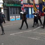 Armed Forces veterans, led by Lt Karl Cleghorn, who served with the Royal Navy and is an ex-chairman of TS Indefatigable, participate in the parade