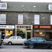A photograph from the 1980s depicting three shops on Bridge Street, Musselburgh. They are H. Maudling (wines and spirits), Robb's (hairdresser) and W. Harrower (bookmaker). All images courtesy of East Lothian Archives & Museums