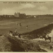 A postcard from the early 20th century depicting the West Links and Marine Hotel, North Berwick. In the foreground are three people riding horses. Beyond them are two people playing golf with two young boys acting as caddies.