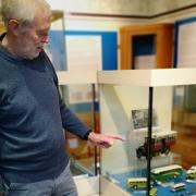 Exhibition organiser Barry Turner points to bus models on loan from Port Seton's James Limerick and City of Edinburgh Museum