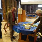 Stephen Bunyan, president of East Lothian Antiquarian and Field Naturalists' Society, cuts a special cake to mark 100 years of the group