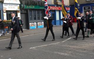 Armed Forces veterans, led by Lt Karl Cleghorn, who served with the Royal Navy and is an ex-chairman of TS Indefatigable, participate in the parade