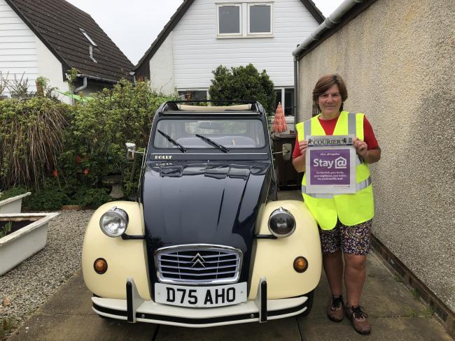 Volunteer Susan Taylor helps drop off Couriers to vulnerable residents in North Berwick