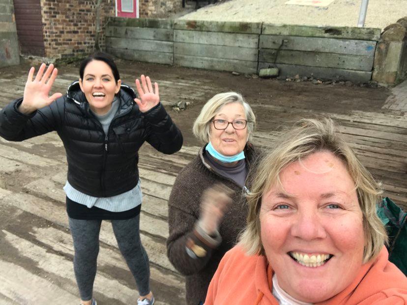 A small boat is being converted into a planter at Cockenzies boat shore. The picture of the three individuals is (from left to right) Hannah Biddulph, Christina Moffat and Sandra Darling.