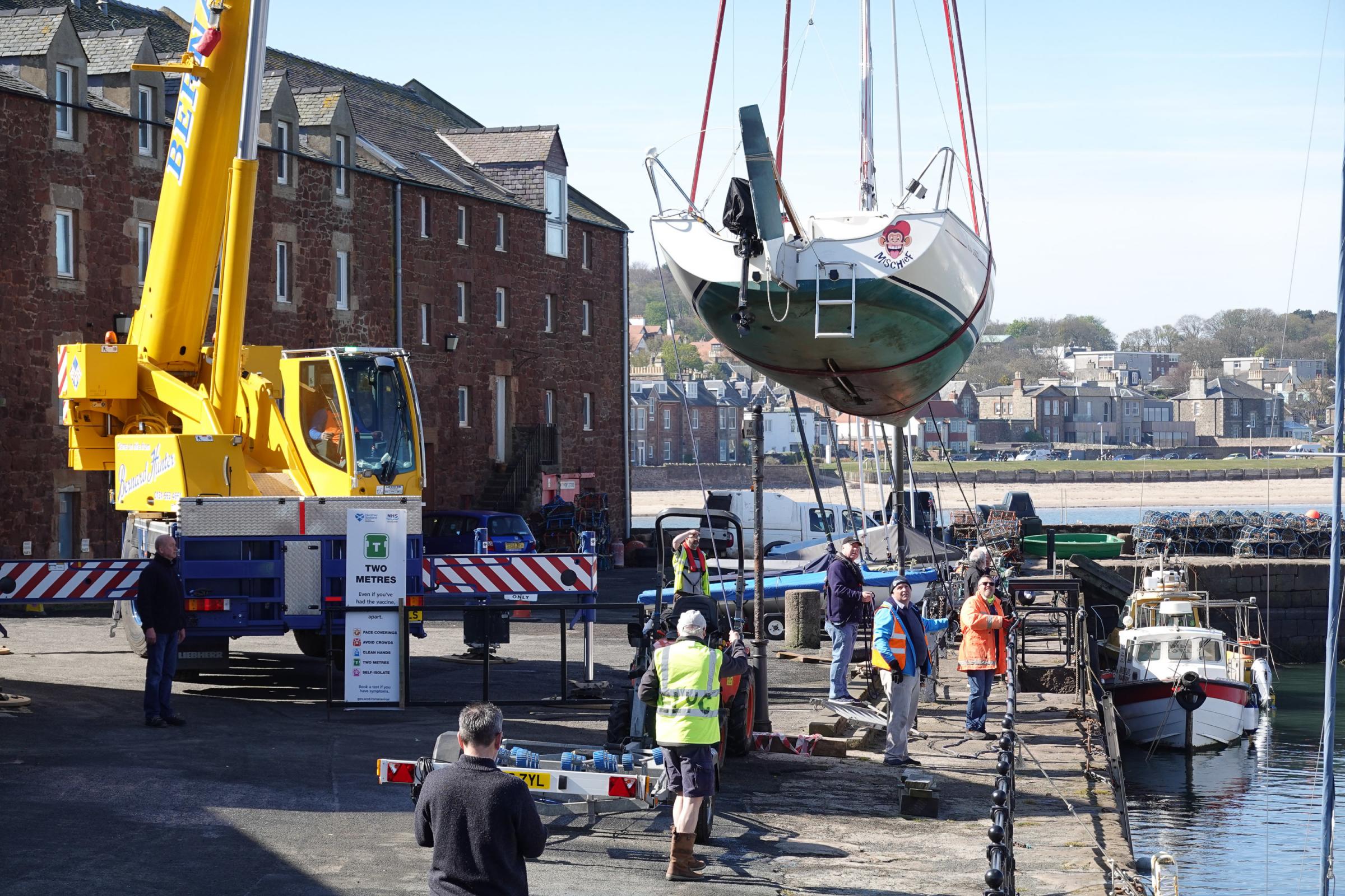 Yachts craned back into North Berwick Harbour for the summer