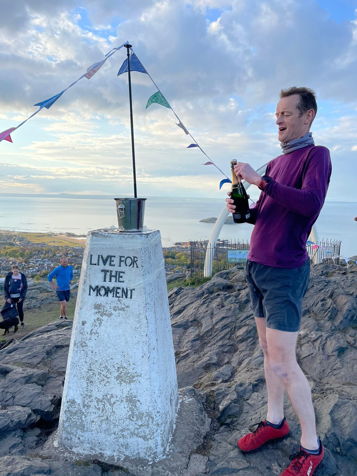 Nigel celebrates the end of his challenge with a bottle of champagne