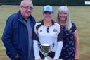 Susan Cockburn with mum and dad Mags and George after her maiden club championship win