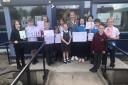 Ann Muir with pupils bidding her farewell. Image: Cockenzie Primary School Twitter