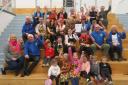 Pupils at Dunbar Grammar School and members of Dunbar Rotary Club celebrate the success of Dinners at DGS