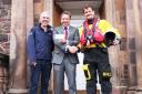 Olly Langton, headmaster of Belhaven Hill School, hands over a cheque to Adrian Lavery (left) and Douglas Wight (right) from Dunbar RNLI