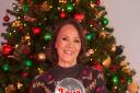 Dame Arlene Phillips in front of a Christmas tree