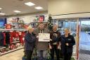 Sean Crawford (centre left) and Kevin Young (centre right) were handed the donation by Our Factory Shop Tranent staff