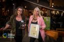 Left to right - Georgie Nicholson, partnerships and contracts manager and Pamela Krawiec, partnerships assistant, both from Hey Girls, with the Social Enterprise of the Year award. Photo: Social Enterprise Scotland