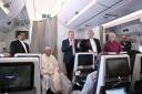 The Archbishop of Canterbury Justin Welby, right, Pope Francis, left, and the Moderator of the General Assembly of the Church of Scotland the Rt Rev Iain Greenshields meet journalists during an airborne press conference aboard the plane directed to Rome,