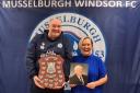 Michael Windram collects the John Murray Shield from Nicky Scally, niece of Mr Murray