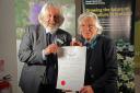 David Knott, honorary president of the Royal Caledonian Horticultural Society, hands over the award to Beryl MacNaughton