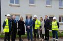 Housing Minister Paul McLennan MSP (fourth left) was joined by Councillor Andy Forrest (second left) as he visited the site of new council housing in Haddington