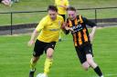 Ormiston Primrose (yellow shirts and black socks) defeated Lochgelly Albert to avoid relegation. Image: David Wardle