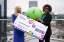 Birmingham based lottery winner Celeste Coles (R), who won £3.6 million in 2022, and The National Lottery’s Kathy Garrett, the person who hands out prizes to lottery winners, in the Secret Garden at the Library of Birmingham, as the city is named