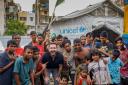 Martin Compston and children at Kamalapur Street Hub in Dhaka, which is supported by Unicef (Unicef/KM Asad/PA)