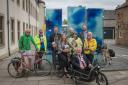 Councillor Shona McIntosh with her cargo bike, with Provost John McMillan, celebrate the delivery of the new maps. Image: Andrew Moncrieff