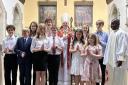 Children confirmed at Our Lady Star of the Sea, North Berwick, by Archbishop Leo Cushley, holding his crozier, symbolising the Good Shepherd. Also pictured is the Rev Father Clement Ajongba, of Our Lady Star of the Sea.